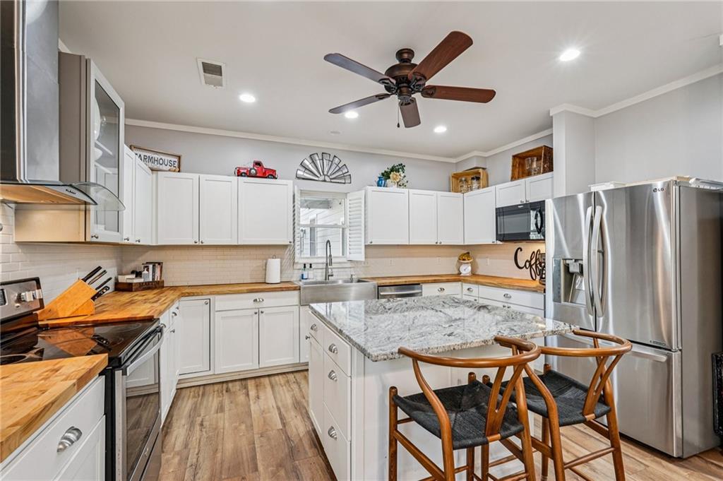 744 Narroway Trail Dallas, GA 30132 - Photo 20 of 59 a kitchen with stainless steel appliances granite countertop a sink stove and refrigerator