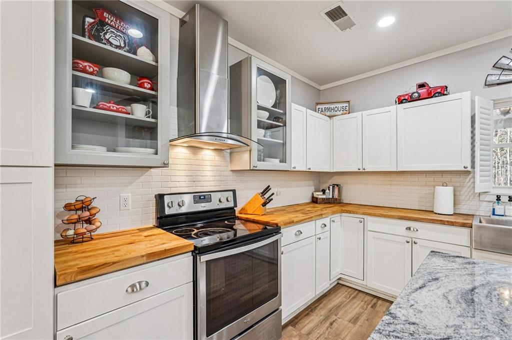 744 Narroway Trail Dallas, GA 30132 - Photo 22 of 59 a kitchen with granite countertop a sink and cabinets