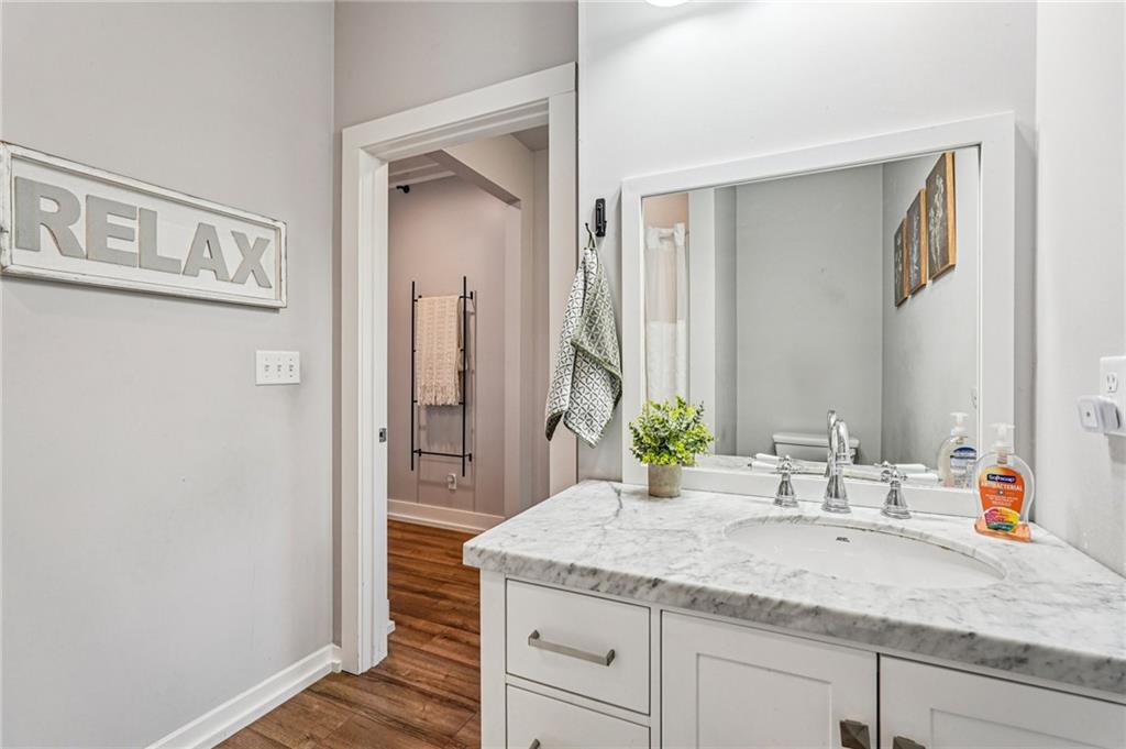 744 Narroway Trail Dallas, GA 30132 - Photo 26 of 59 a bathroom with a granite countertop sink and a mirror