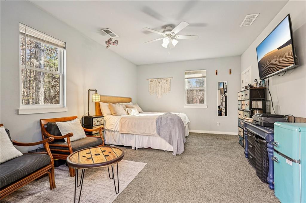 744 Narroway Trail Dallas, GA 30132 - Photo 28 of 59 a bedroom with furniture and a flat screen tv