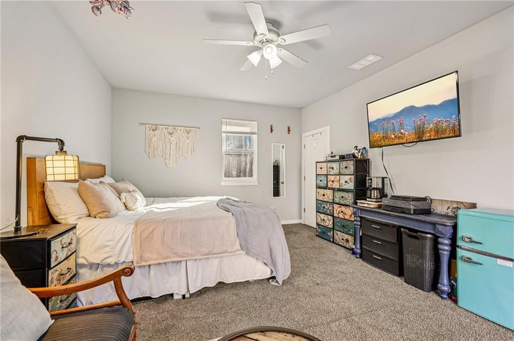 744 Narroway Trail Dallas, GA 30132 - Photo 29 of 59 a bedroom with a bed and a chandelier