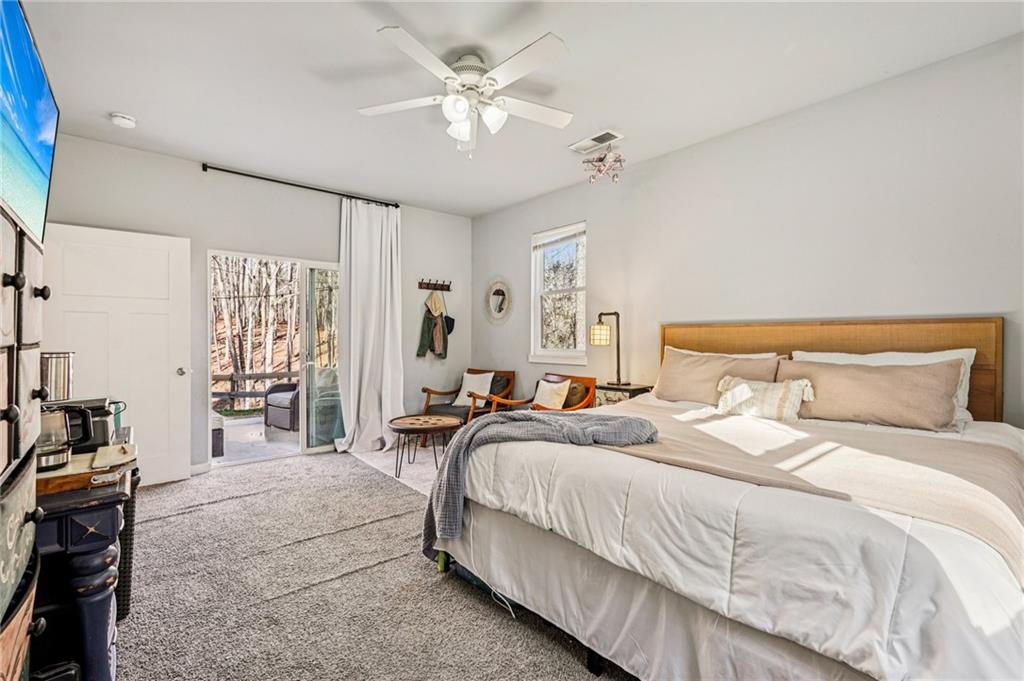 744 Narroway Trail Dallas, GA 30132 - Photo 30 of 59 a bedroom with bed and a chandelier