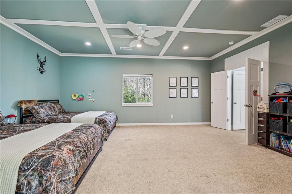 744 Narroway Trail Dallas, GA 30132 - Photo 35 of 59 a bedroom with a large bed and a window