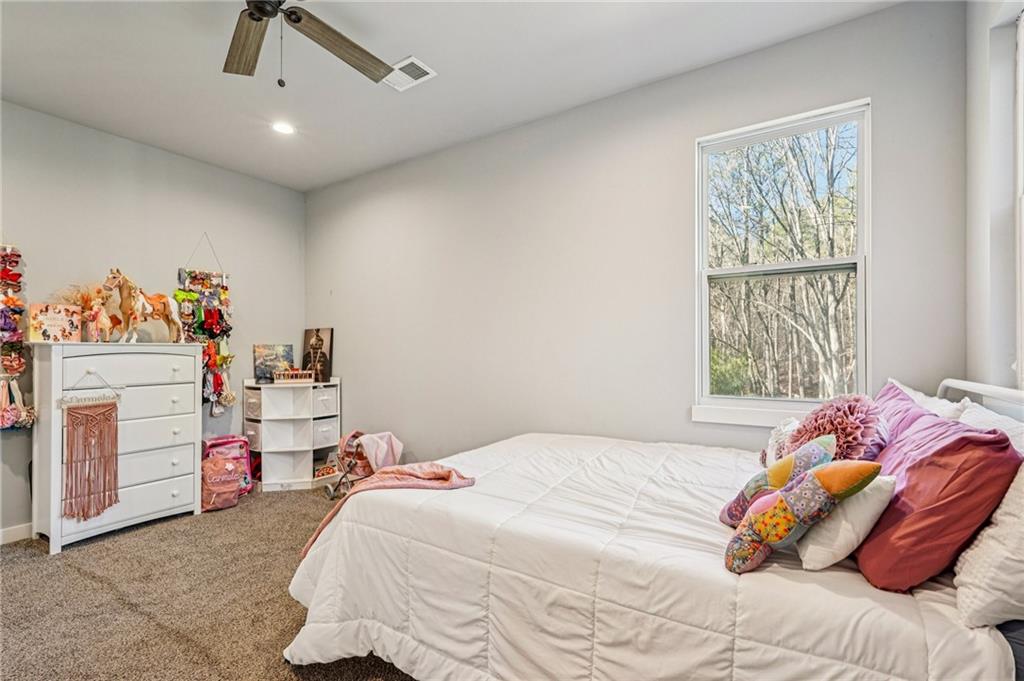 744 Narroway Trail Dallas, GA 30132 - Photo 39 of 59 a bedroom with a bed and a window