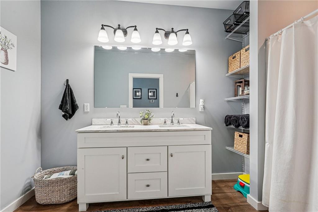 744 Narroway Trail Dallas, GA 30132 - Photo 40 of 59 a bathroom with a sink a vanity and a mirror