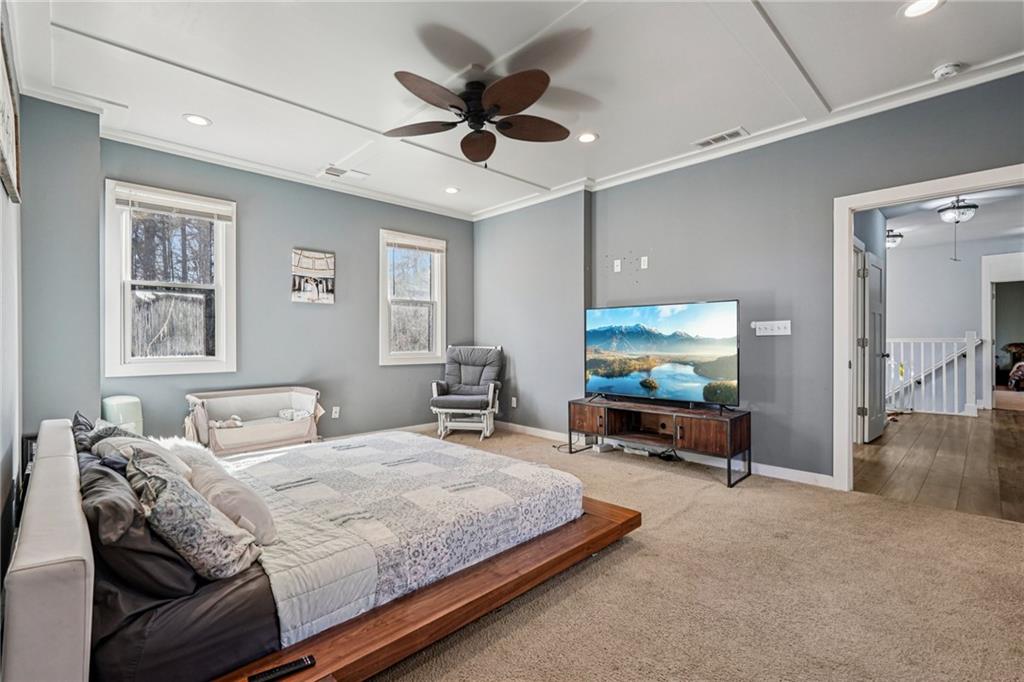 744 Narroway Trail Dallas, GA 30132 - Photo 44 of 59 a bedroom with two beds and a chandelier