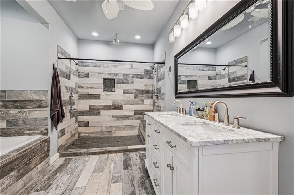 744 Narroway Trail Dallas, GA 30132 - Photo 45 of 59 a bathroom with a granite countertop sink a mirror and shower