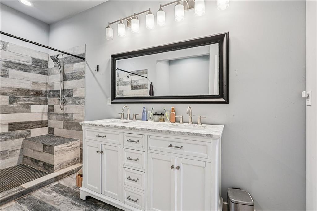 744 Narroway Trail Dallas, GA 30132 - Photo 46 of 59 a bathroom with a sink vanity and a mirror