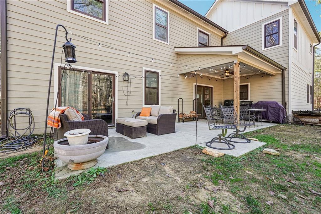 744 Narroway Trail Dallas, GA 30132 - Photo 51 of 59 a view of a patio with couches chairs and potted plants
