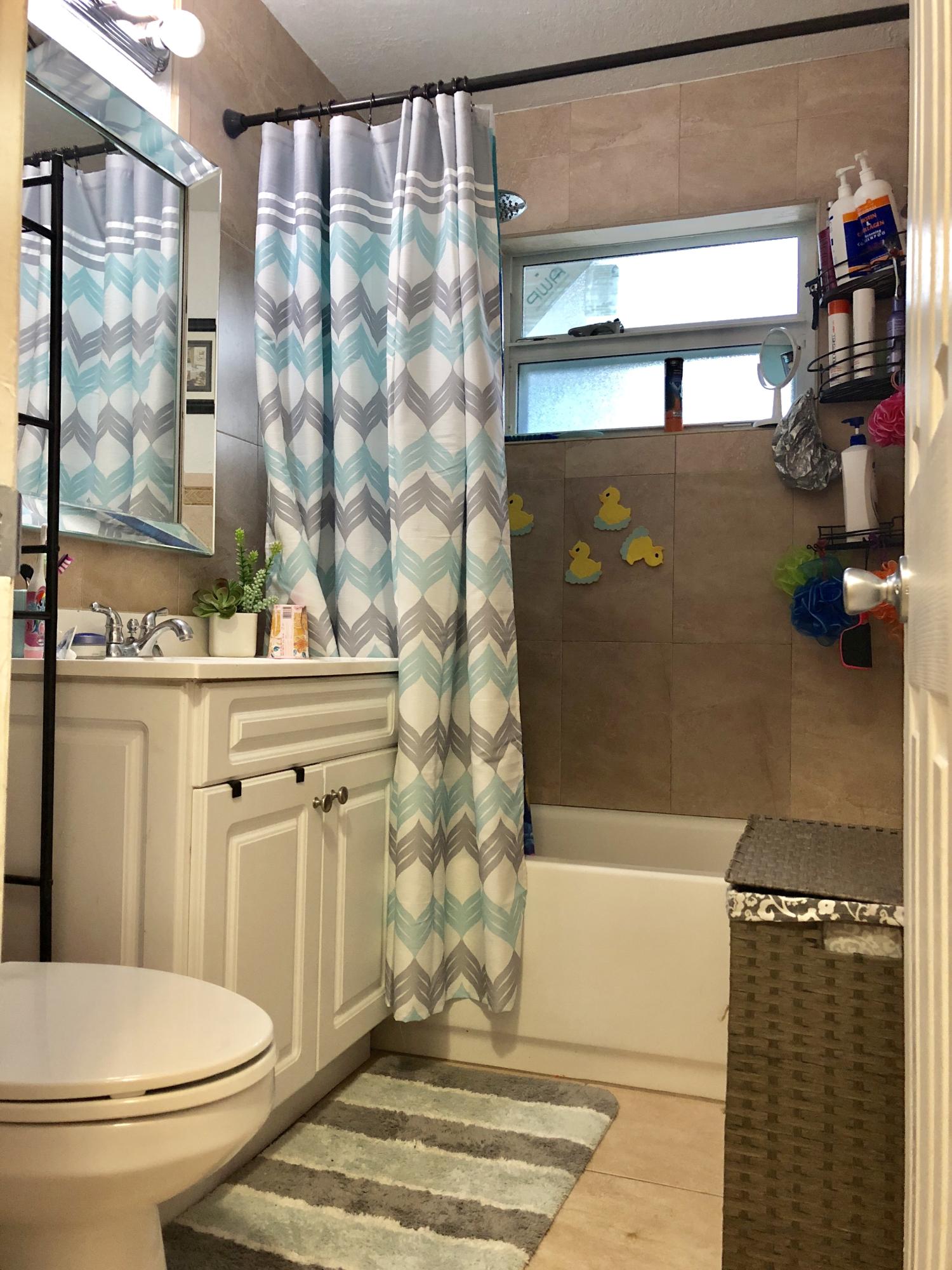 4228 Gulfstream Road Lake Worth, FL 33461 - Photo 5 of 21 a bathroom with a sink toilet and shower