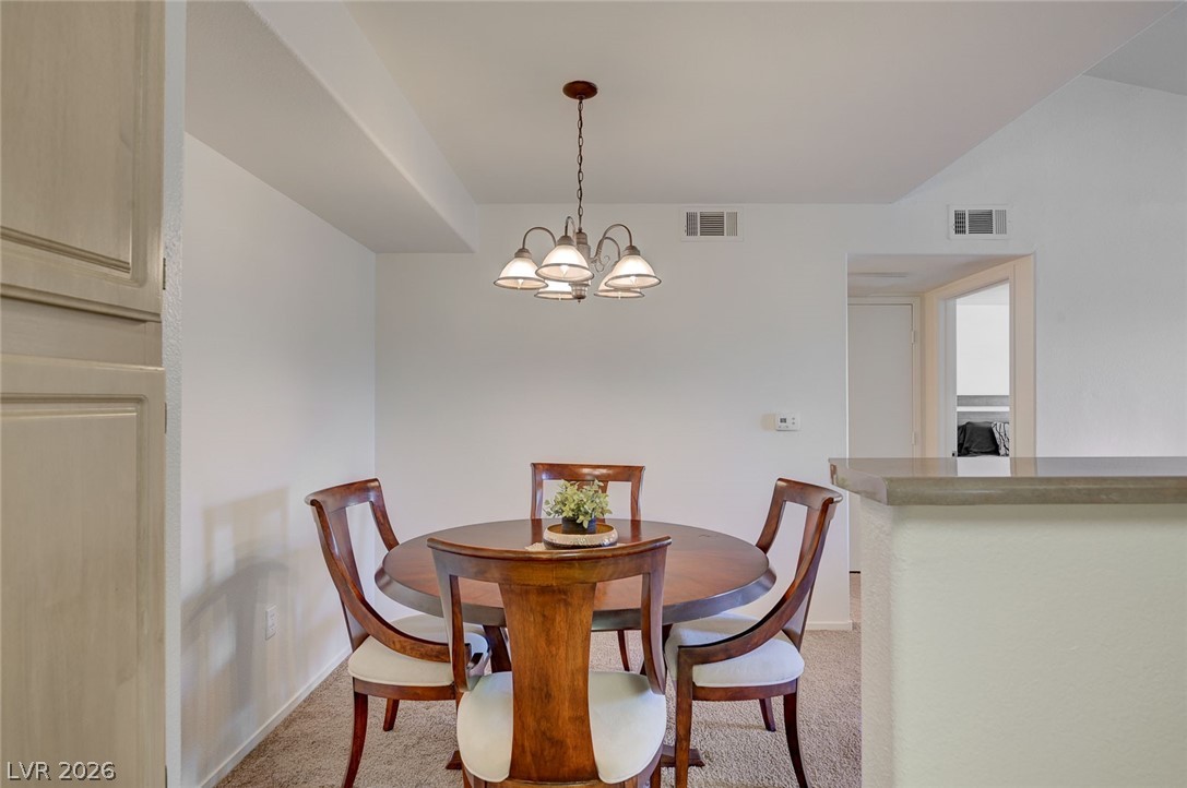 555 East Silverado Ranch Boulevard, Unit 2124 Las Vegas, NV 89183 - Photo 21 of 47 A well-lit dining area offers a seamless flow for entertaining and daily meals.