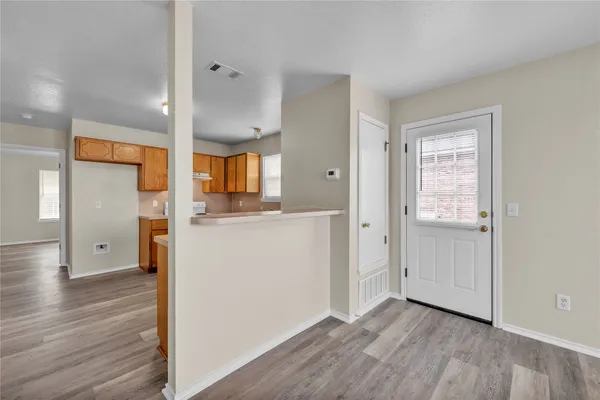 wooden floor in an empty room and a window