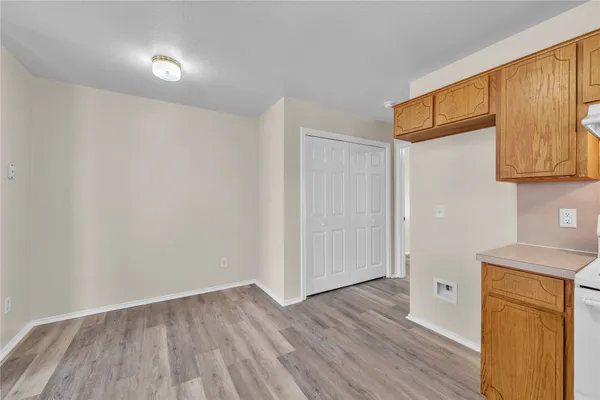 a view of hallway with wooden floor