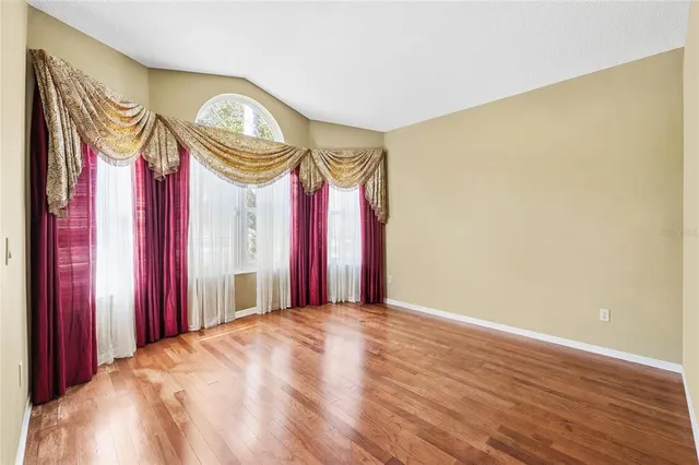 a very nice looking room with a large bed and a chandelier