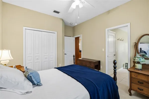 a bedroom with a bed and a dresser