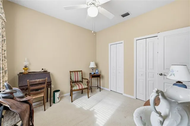 a livingroom with furniture and a potted plant