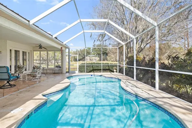 a view of swimming pool with outdoor seating