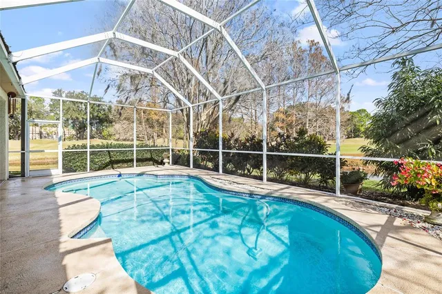 a view of a white building with a swimming pool
