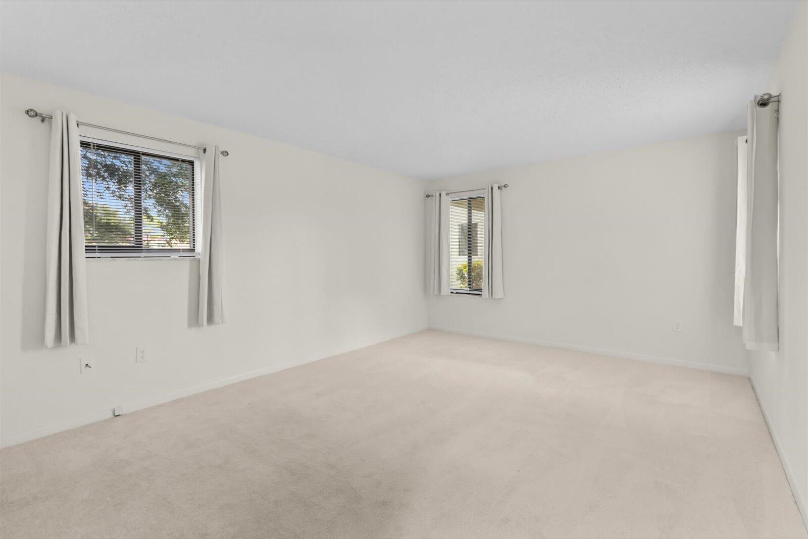 5413 Southeast Miles Grant Road, Unit G104 Stuart, FL 34997 - Photo 22 of 38 Bedroom