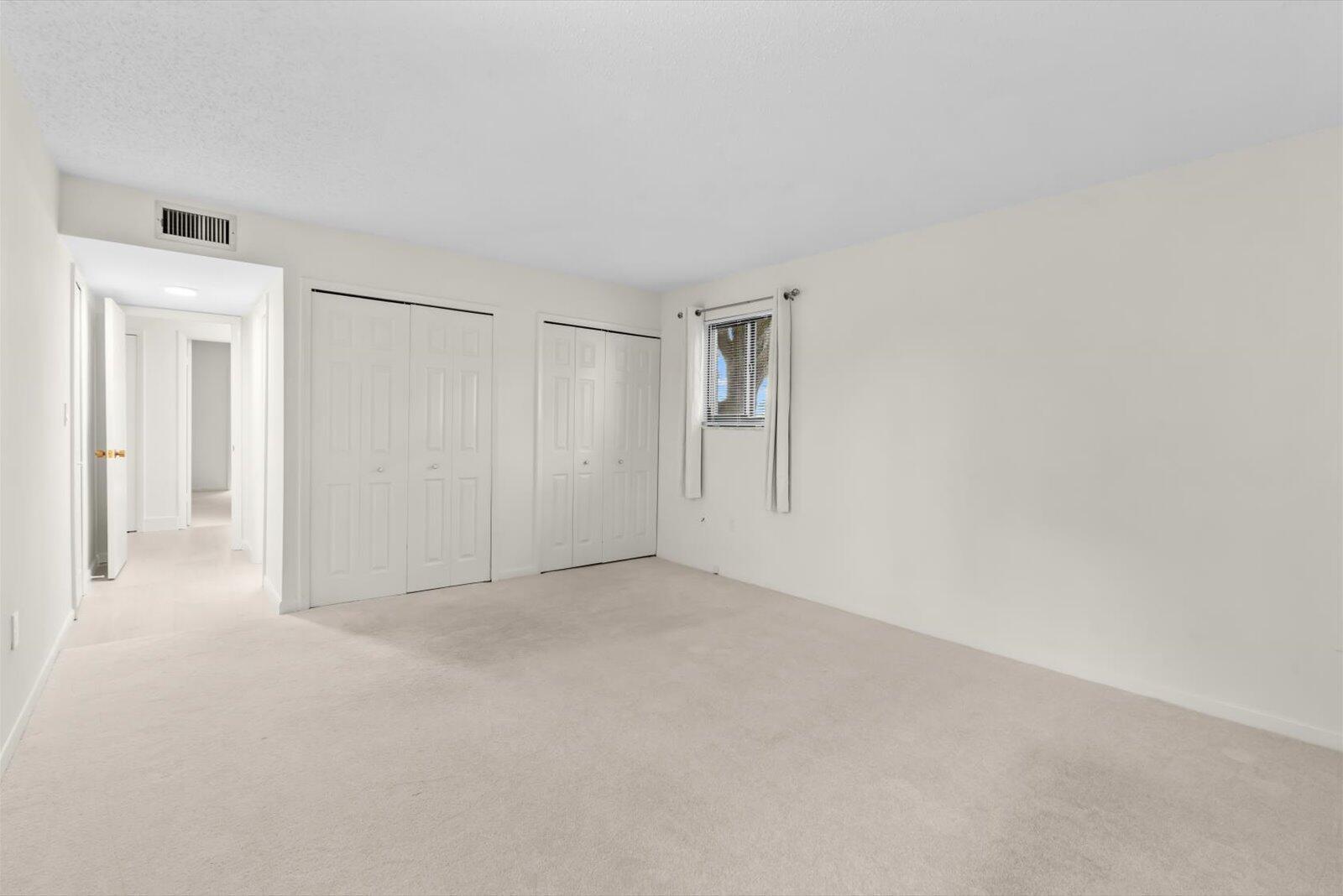 5413 Southeast Miles Grant Road, Unit G104 Stuart, FL 34997 - Photo 24 of 38 Bedroom