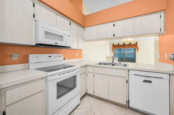 a view of a hallway with a refrigerator
