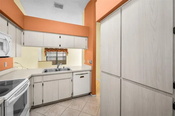 a view of a room with a chandelier and closet