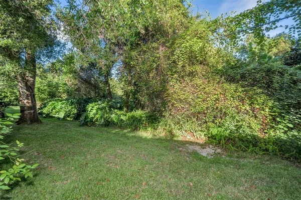 a view of swimming pool with a yard