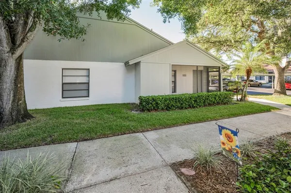 a view of a house with a back yard