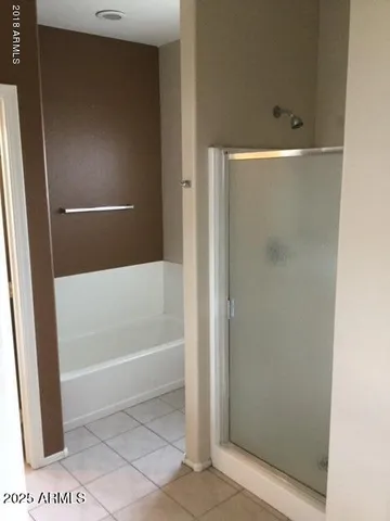 a view of a house with backyard porch and sitting area