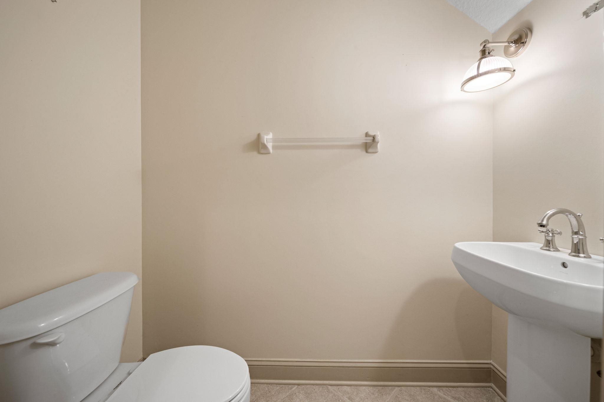 650 South Loop Street St. Augustine, FL 32095 - Photo 11 of 40 a bathroom with a sink a toilet and shower