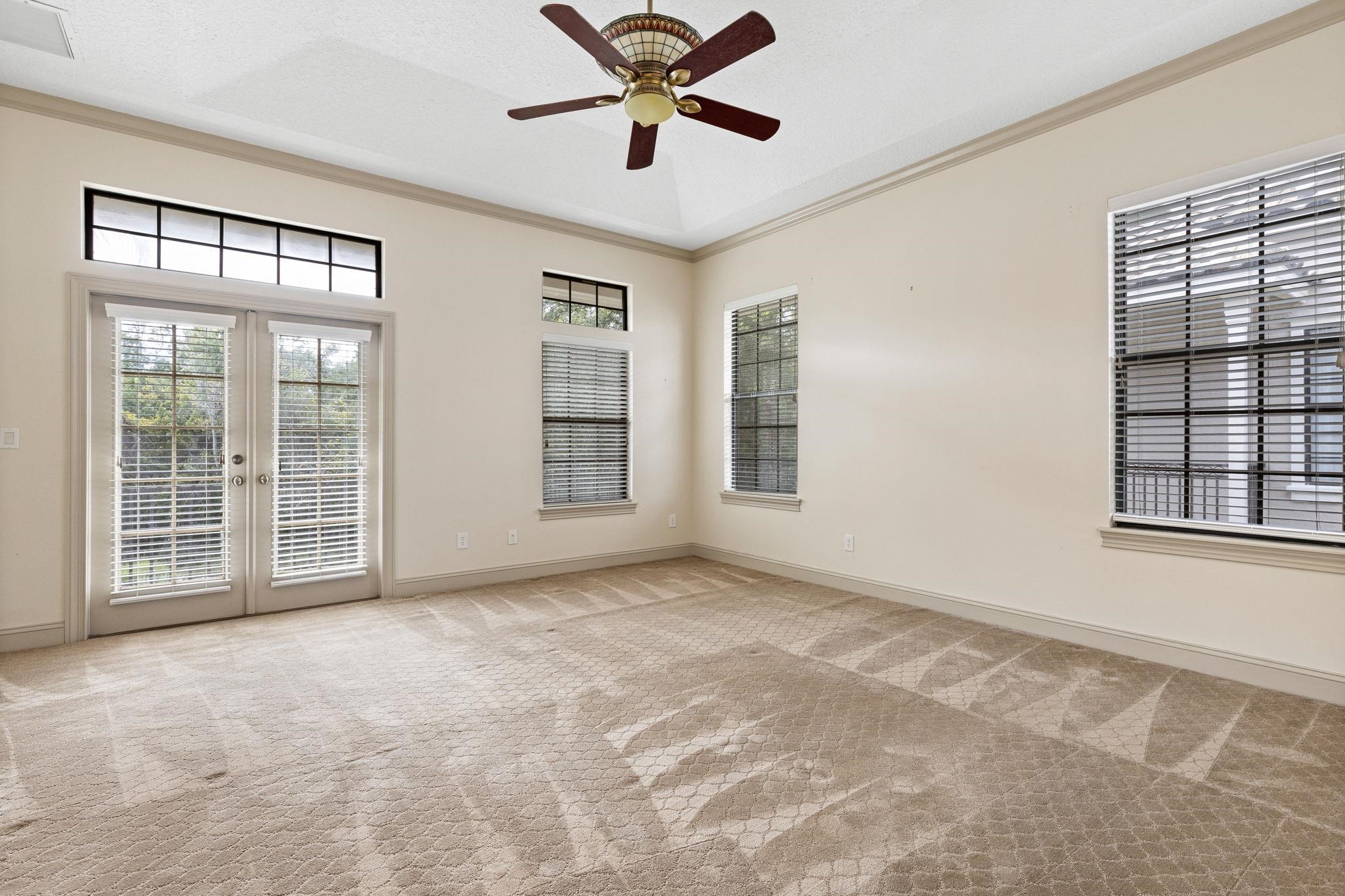 650 South Loop Street St. Augustine, FL 32095 - Photo 13 of 40 a view of an empty room with a window and a ceiling fan