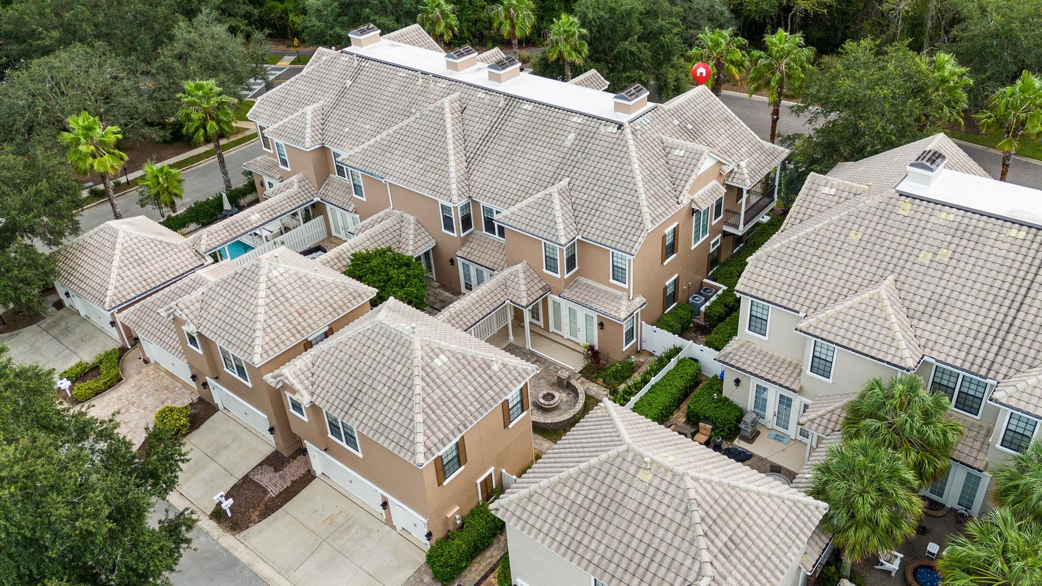 650 South Loop Street St. Augustine, FL 32095 - Photo 2 of 40 an aerial view of a house with backyard and outdoor seating