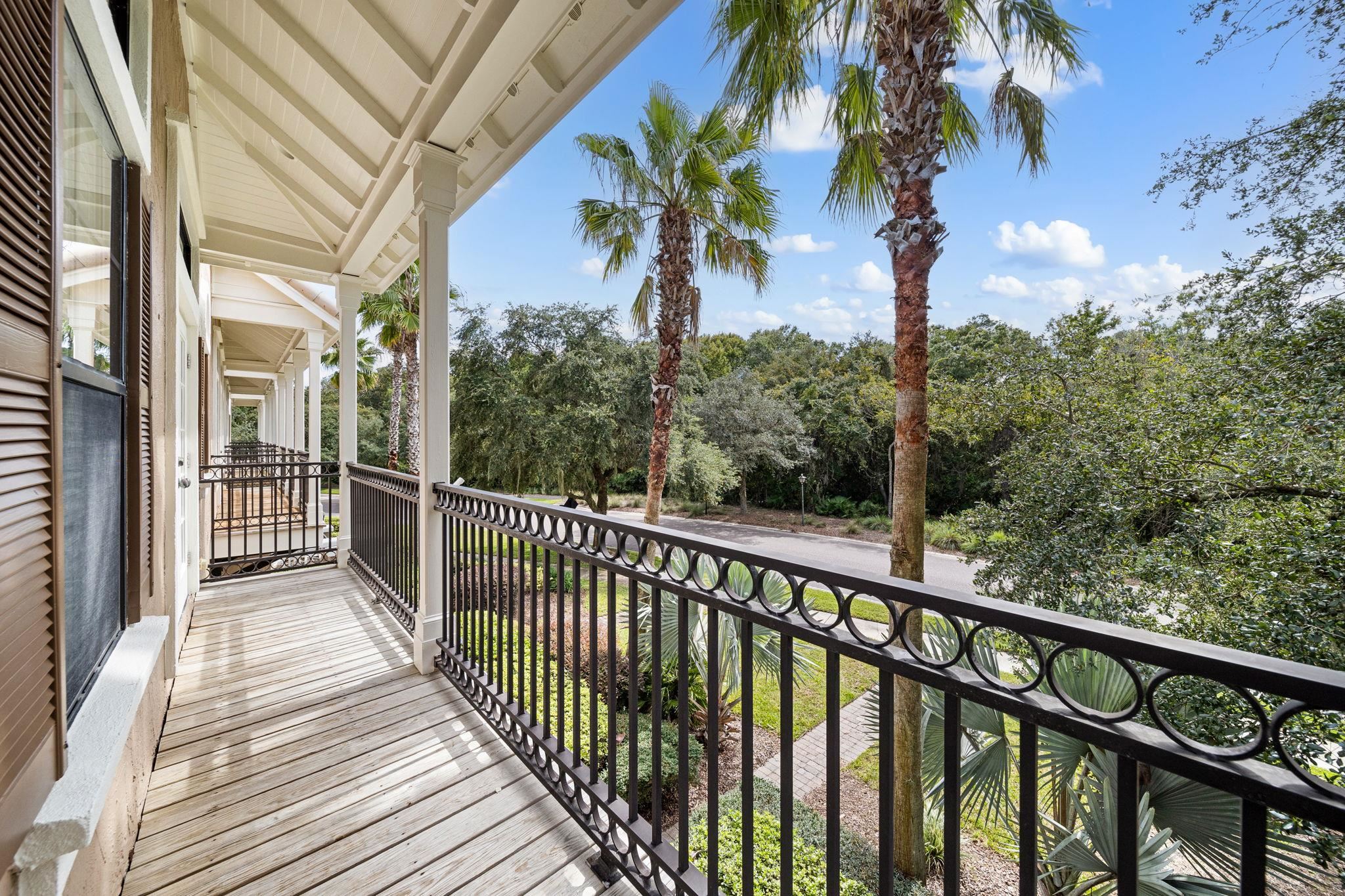 650 South Loop Street St. Augustine, FL 32095 - Photo 21 of 40 a view of a wooden balcony and trees
