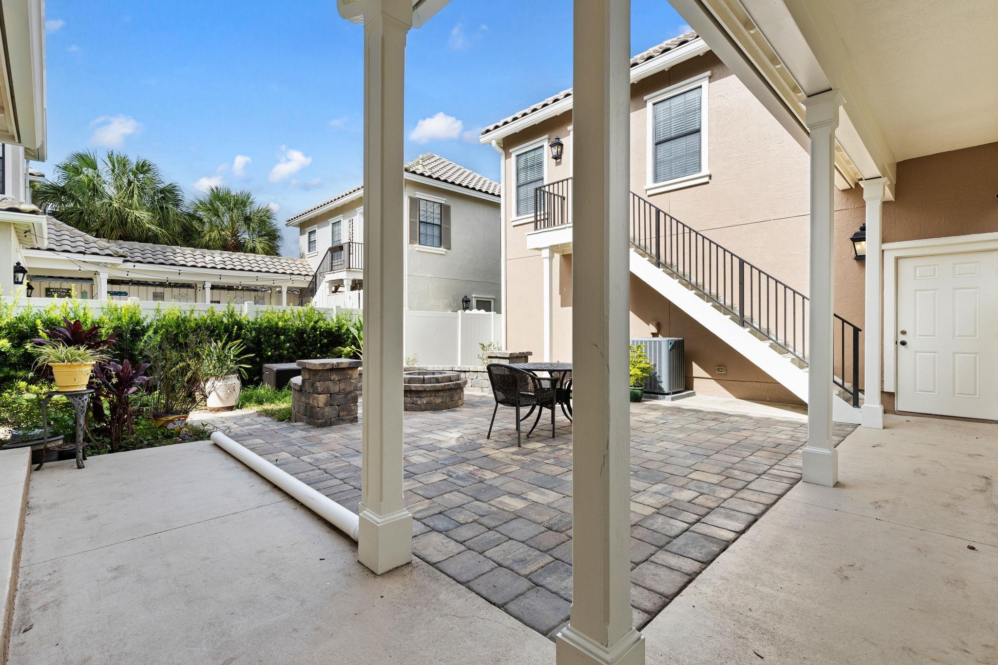 650 South Loop Street St. Augustine, FL 32095 - Photo 24 of 40 a view of a house with backyard and sitting area