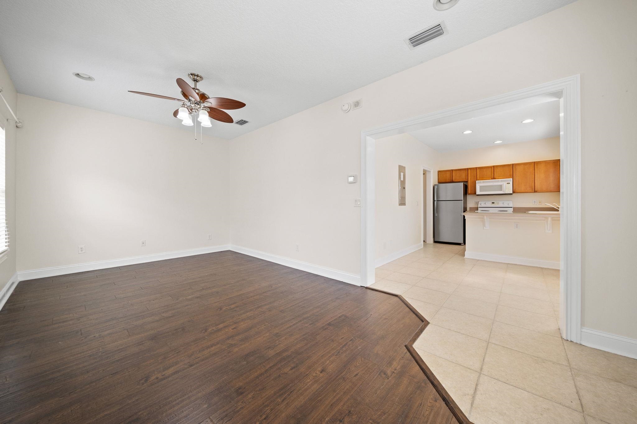 650 South Loop Street St. Augustine, FL 32095 - Photo 25 of 40 wooden floor in an empty room with a window