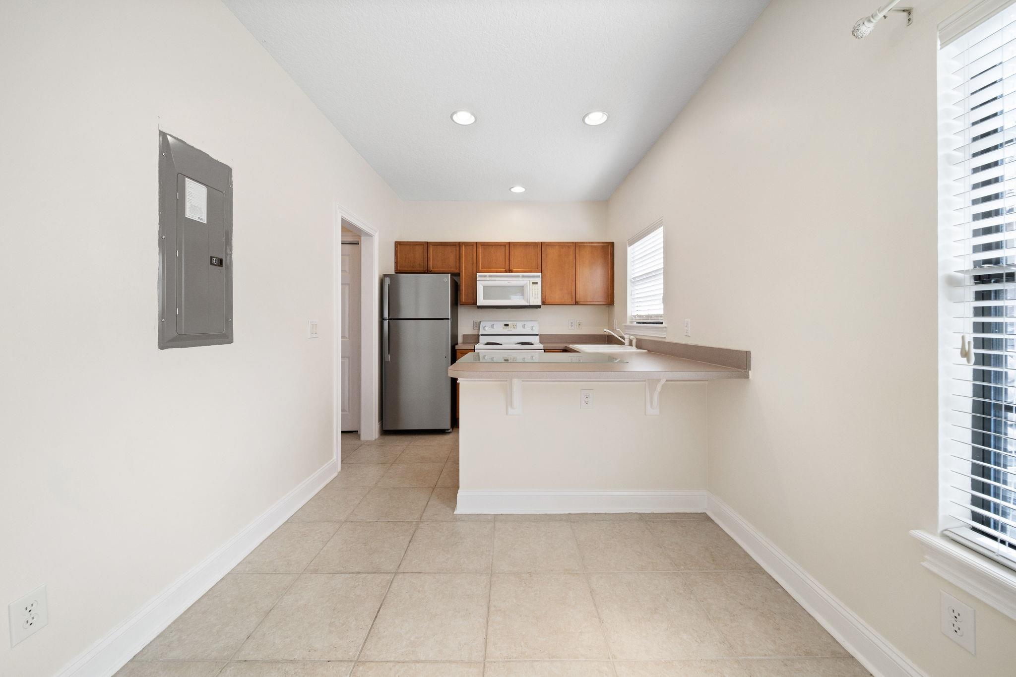 650 South Loop Street St. Augustine, FL 32095 - Photo 27 of 40 a view of kitchen with refrigerator and window