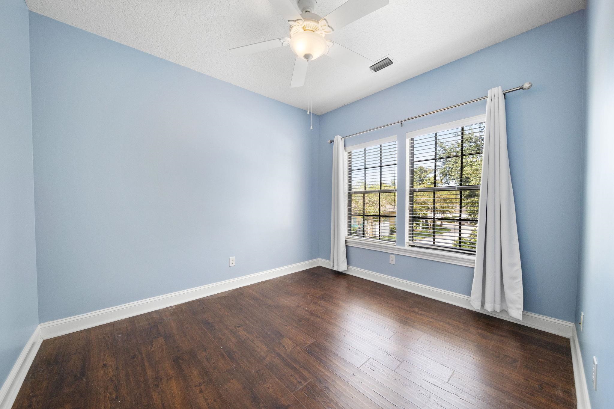 650 South Loop Street St. Augustine, FL 32095 - Photo 28 of 40 wooden floor in an empty room with a window