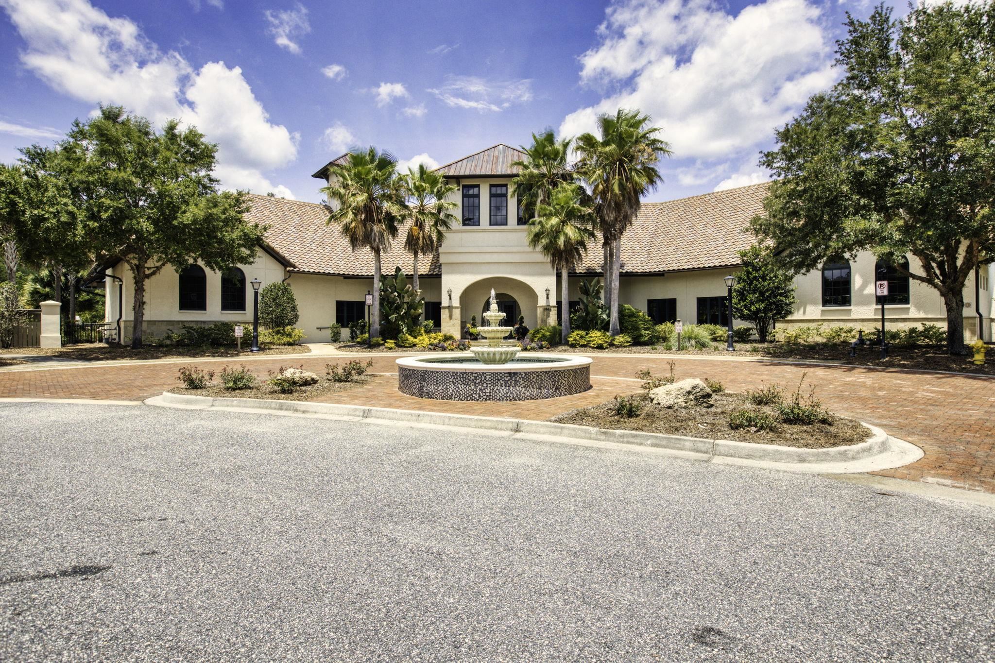 650 South Loop Street St. Augustine, FL 32095 - Photo 32 of 40 a view of a white house with a large tree in front of it