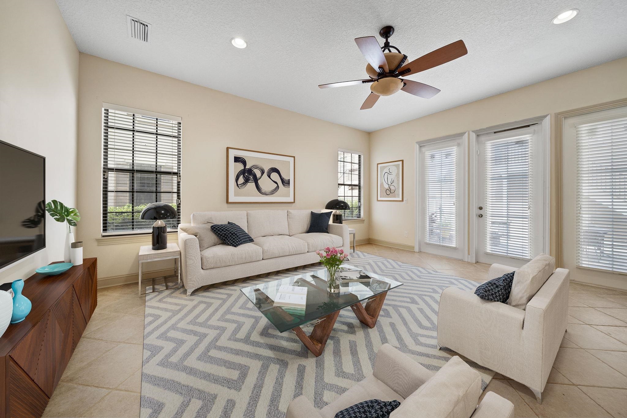 650 South Loop Street St. Augustine, FL 32095 - Photo 39 of 40 a living room with furniture a ceiling fan and a large window