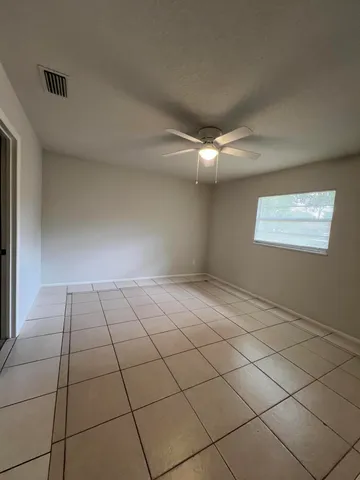a view of an empty room and window