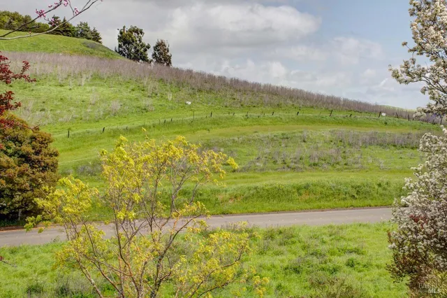 a view of a lake with a big yard