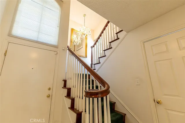 a view of a porch with furniture and a window