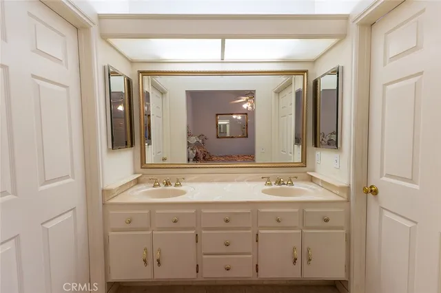 a bedroom with a bed and a television