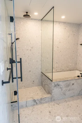 a bathroom with a shower and a sink