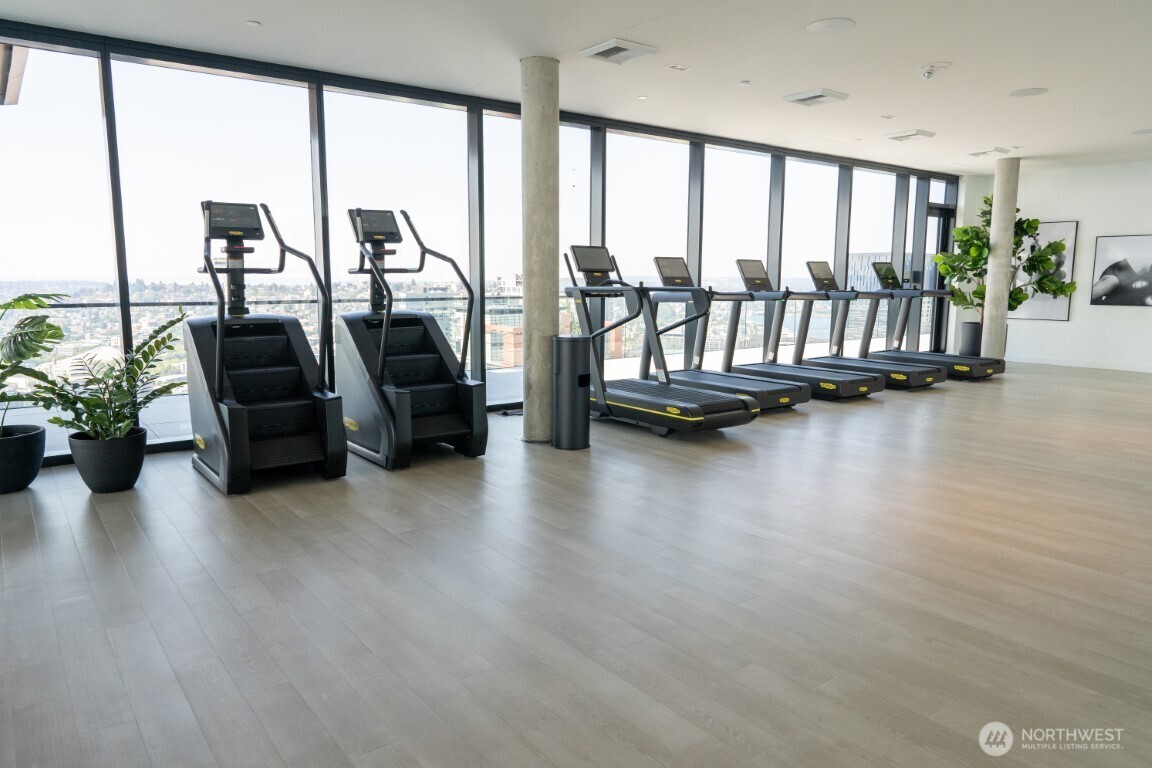 300 Virginia Street, Unit 4403 Seattle, WA 98101 - Photo 25 of 40 a living room with furniture and floor to ceiling window