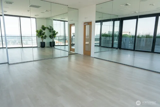 a view of an entryway with wooden floor
