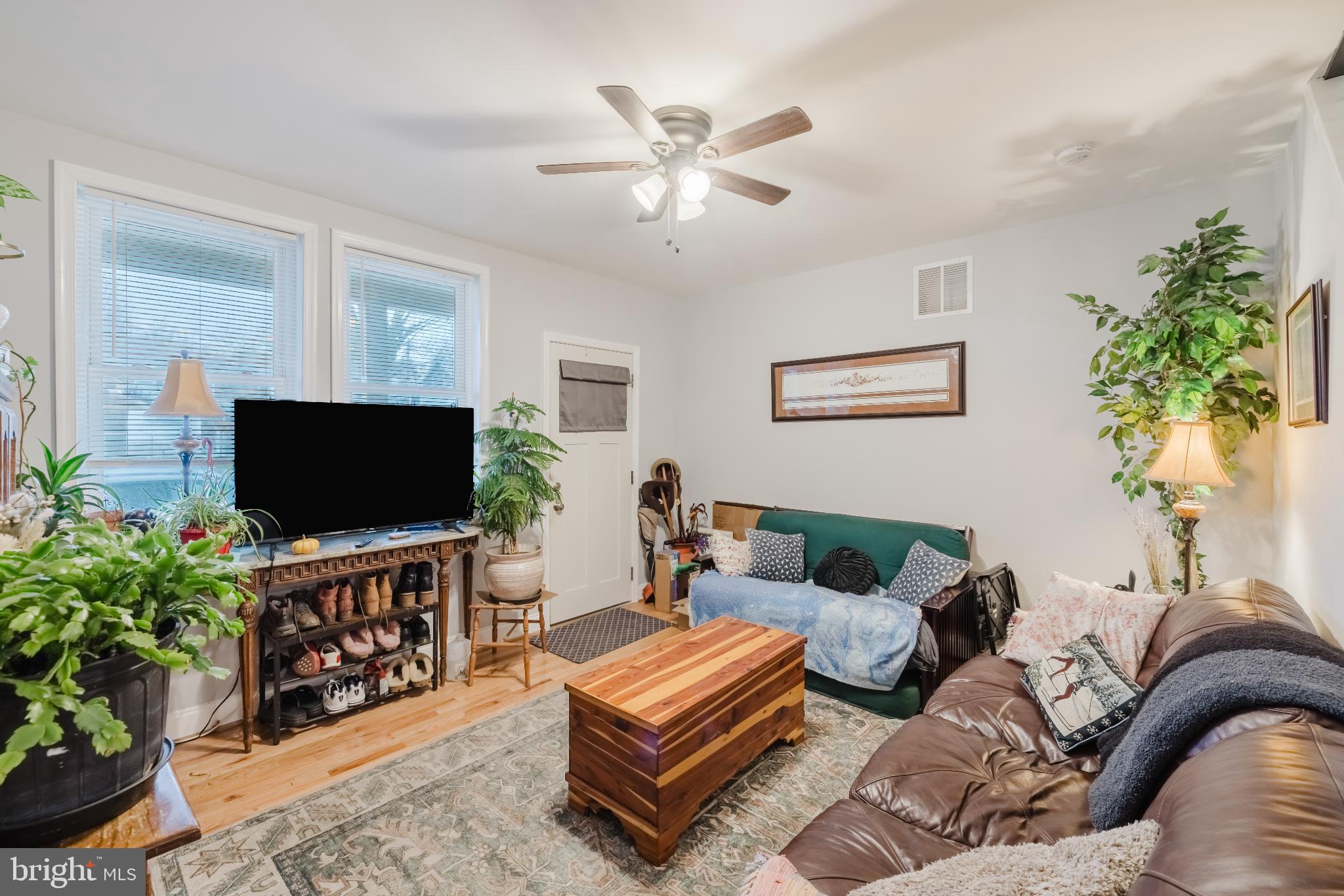 3804 Falls Road Baltimore, MD 21211 - Photo 3 of 23 Cozy living room with beautiful hardwood floors