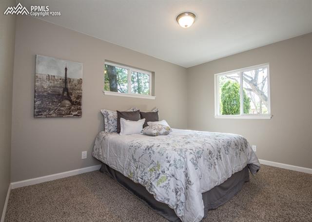 408 Placid Road Colorado Springs, CO 80910 - Photo 13 of 36 There are two windows in the Master Bedroom to let natural light fill the room.