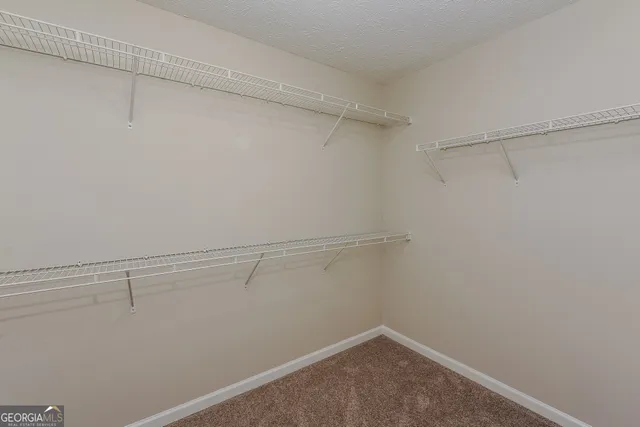 a view of a room with racks on the wall