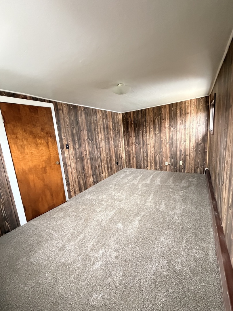 106 Main Street Lostant, IL 61334 - Photo 12 of 18 a view of an empty room with a window